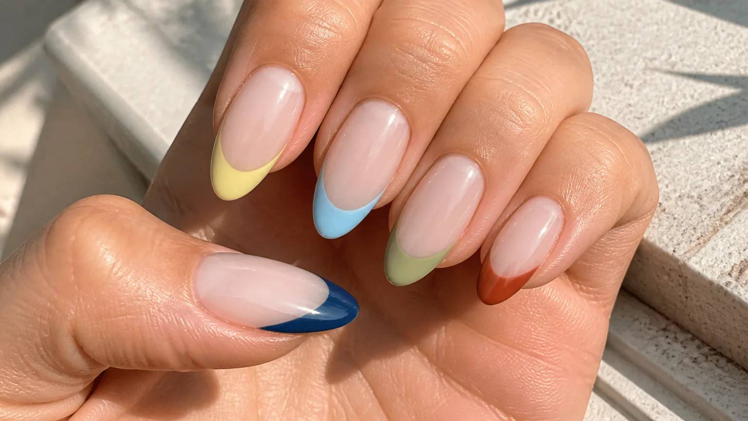 Hand with colorful French tip nails
