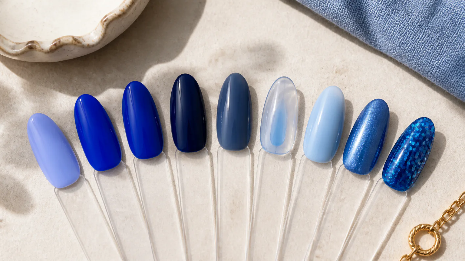 Blue nail polish swatches on clear sticks