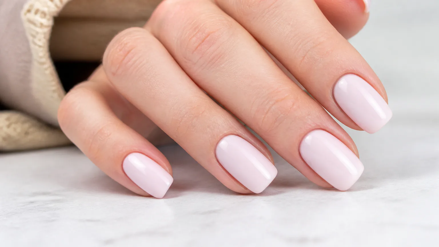 OPI Lisbon Wants Moor Hand with glossy pale pink manicure